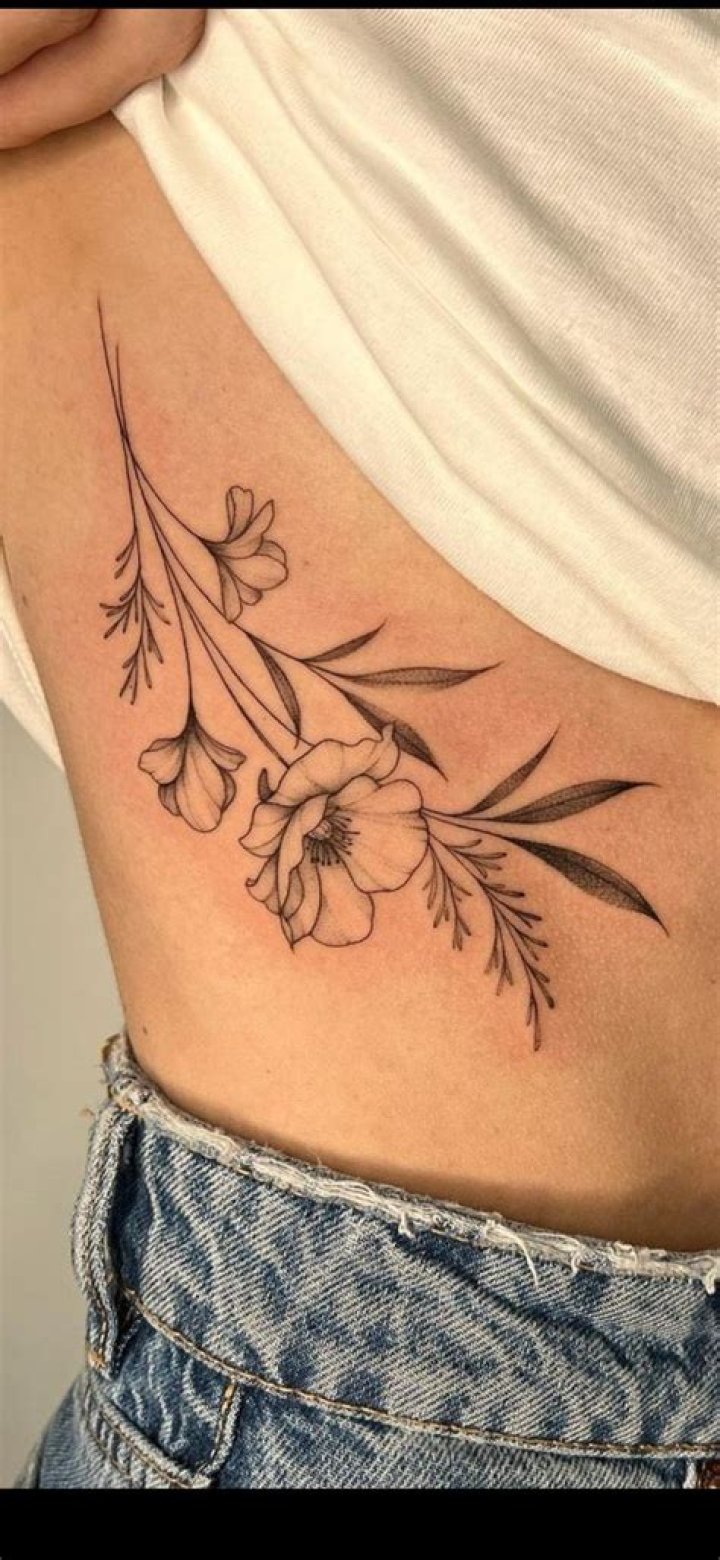 Enchanting Floral Rib Tattoos: A Symphony Of Delicate Designs