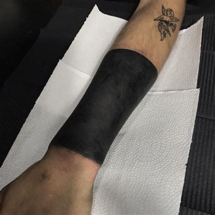 Exploring The Depths: The Meaning Behind Blackout Tattoos
